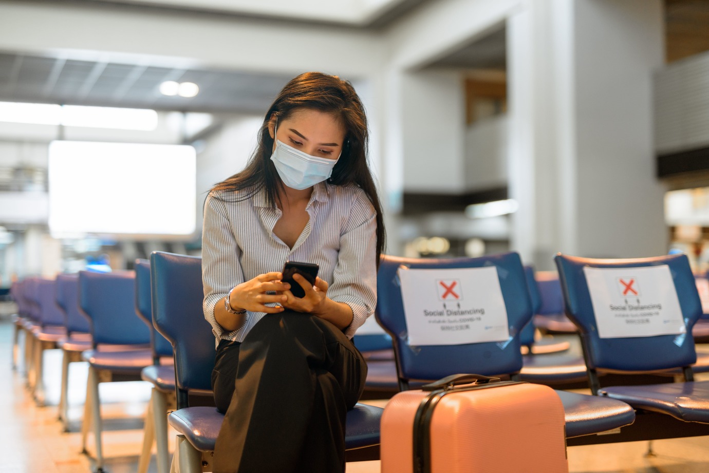 Woman wearing mask in airport
