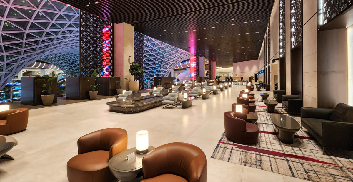 Premium airport lounge with spa services, fine dining area, and elegant seating