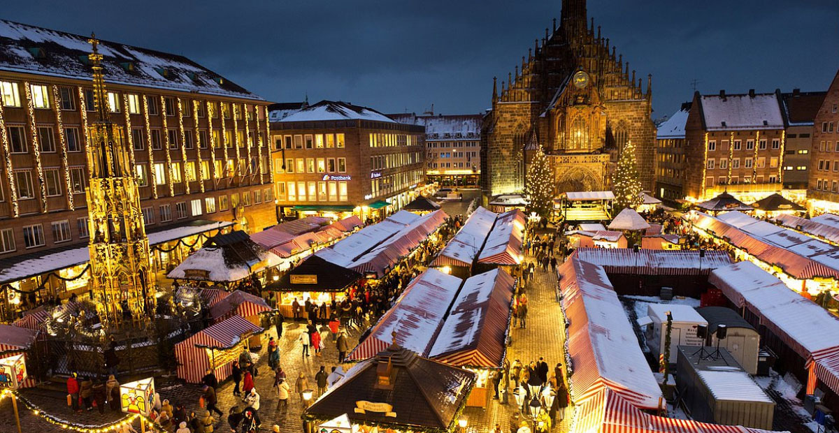 A bustling Nuremberg Christmas Market in Germany, filled with festive stalls, glowing lights, and holiday decorations.