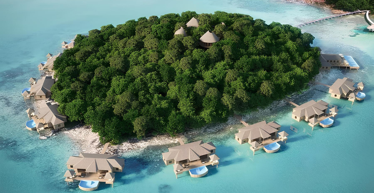 Luxury island resort in the Maldives with turquoise waters and overwater villas.